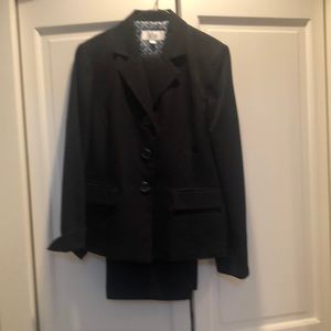 Black suit size 10. Lightweight fabric.  Jacket and pants are fully lined.